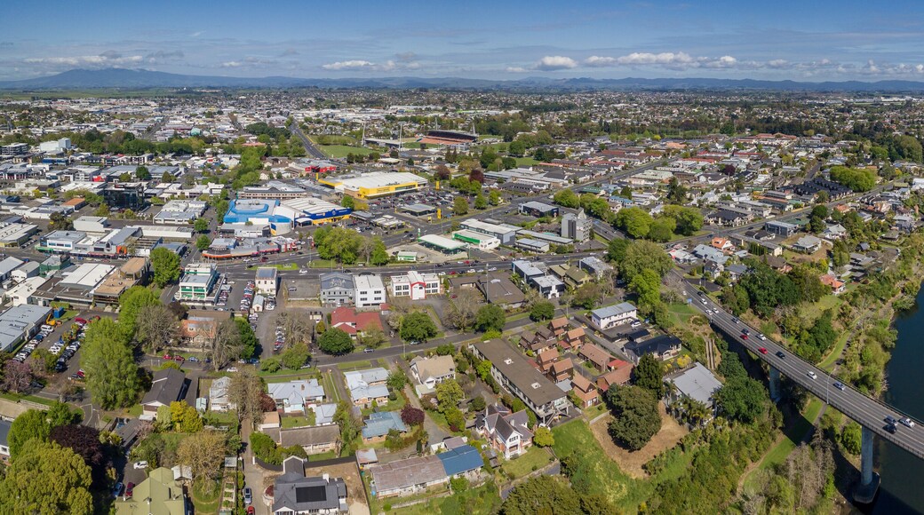 Aerial drone panoramic view looking at Whitiora Bridge over the Waikato River as it cuts through the city of Hamilton, in the Waikato region of New Zealand