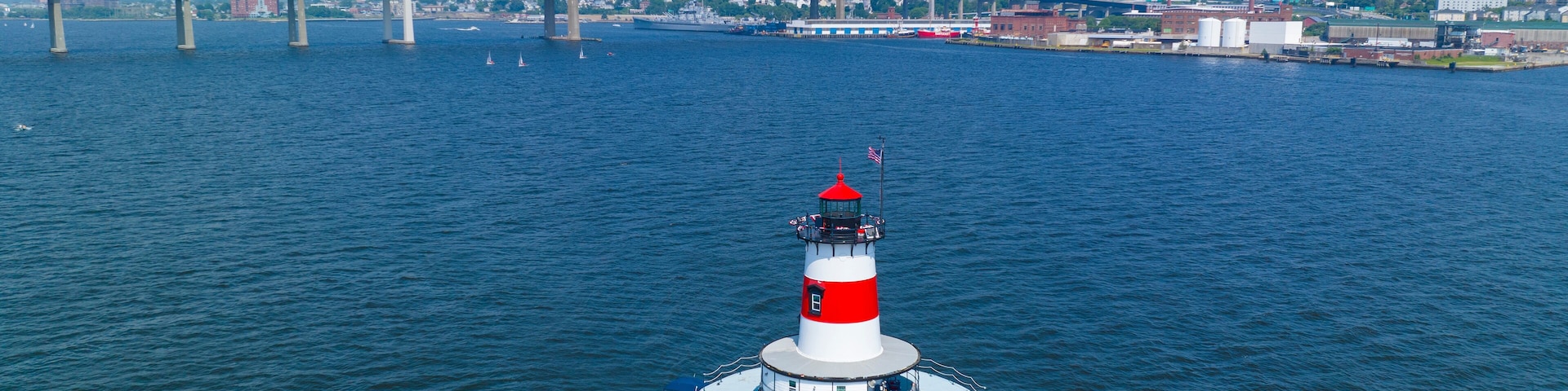 Borden Flats Lighthouse aerial view with Braga Bridge at the back. The lighthouse is a historic lighthouse on the Taunton River in city of Fall River, Massachusetts MA, USA.