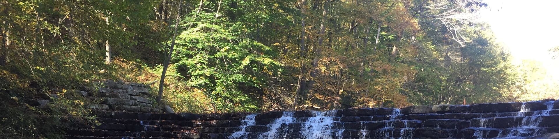 This is Jones Mill Run Dam, located in Laurel Hill State Park in western Pennsylvania. It's a relatively short hike to get to this spot, but it's worth it to explore more of Laurel Hill's trails. There's something different to see in every season, but make sure you stop by the park office to pick up a trail map. #hiking #Pennsylvania
