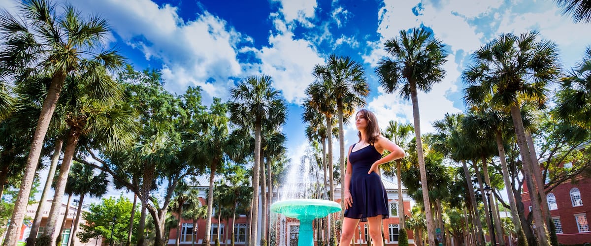 Stetson University Holler fountain woman in blue dress gazing off into the future