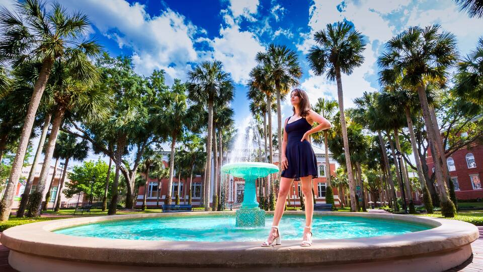 Stetson University Holler fountain woman in blue dress gazing off into the future