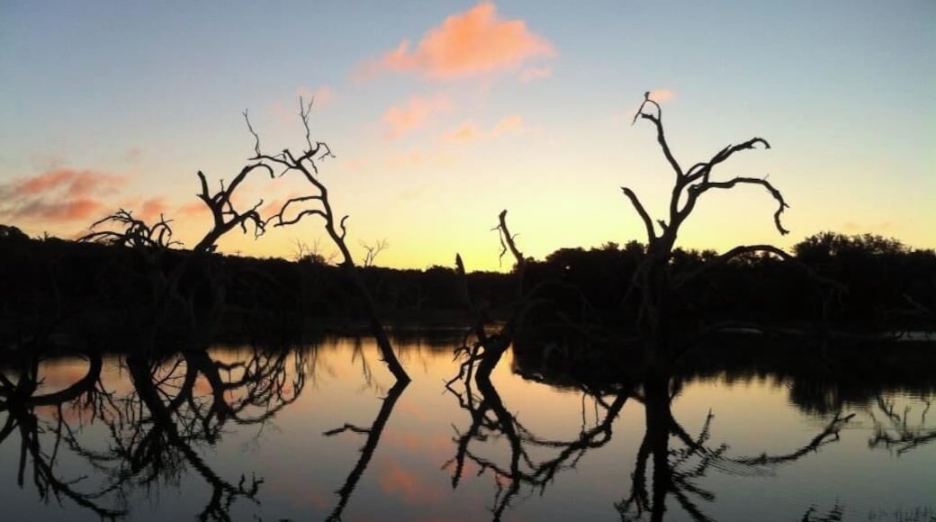 Sunrise over the lake at Reveille Peak Ranch in the Texas Hill Country. Reveille Peak Ranch offers on-site camping and activities such as mountain biking and SCUBA. #LifeAtExpediaGroup