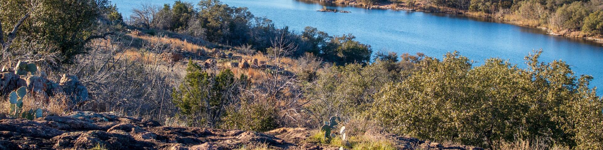 Texas Hill Country lake views from the top of a hill on a trail located in Inks Lake State Park, Burnet Texas. Texas State Parks Celebrating 100 years.