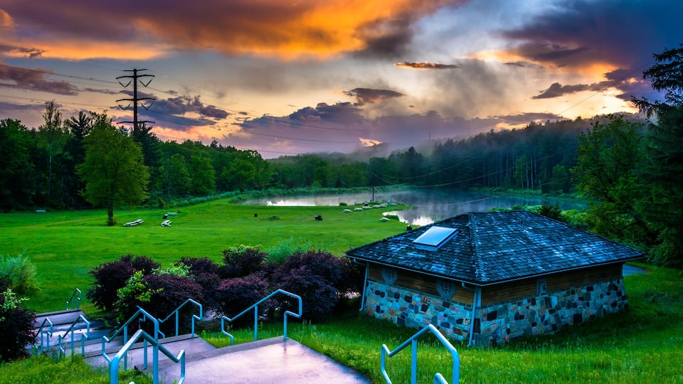 Sunset over building and ponds at Delaware Water Gap National Re