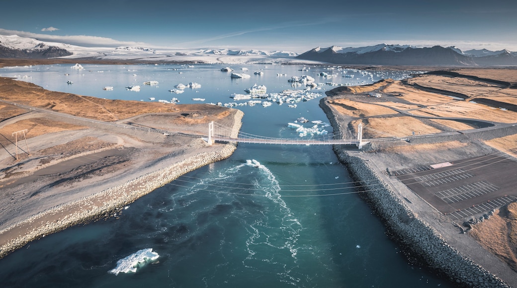 ice block over black sand in diamond beach at sunrise from aerial view