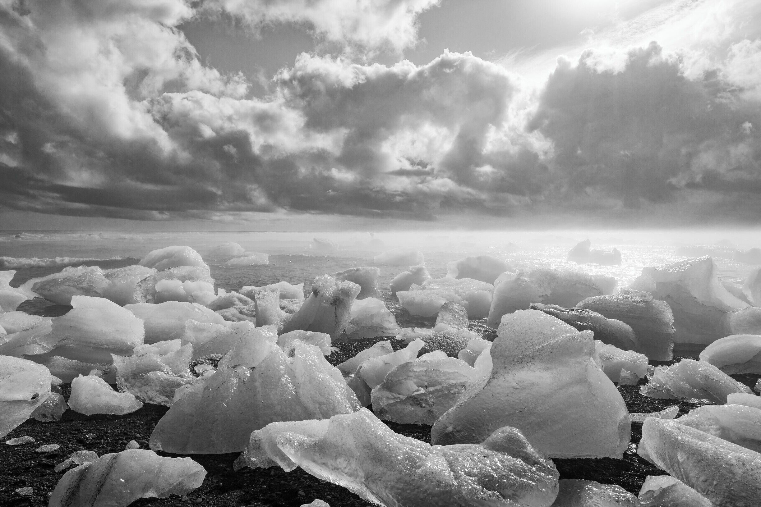 The beach at Jokulsaron collects the pieces of ice the glacier spits out. Punctuating the black sand at the edge of the water. 