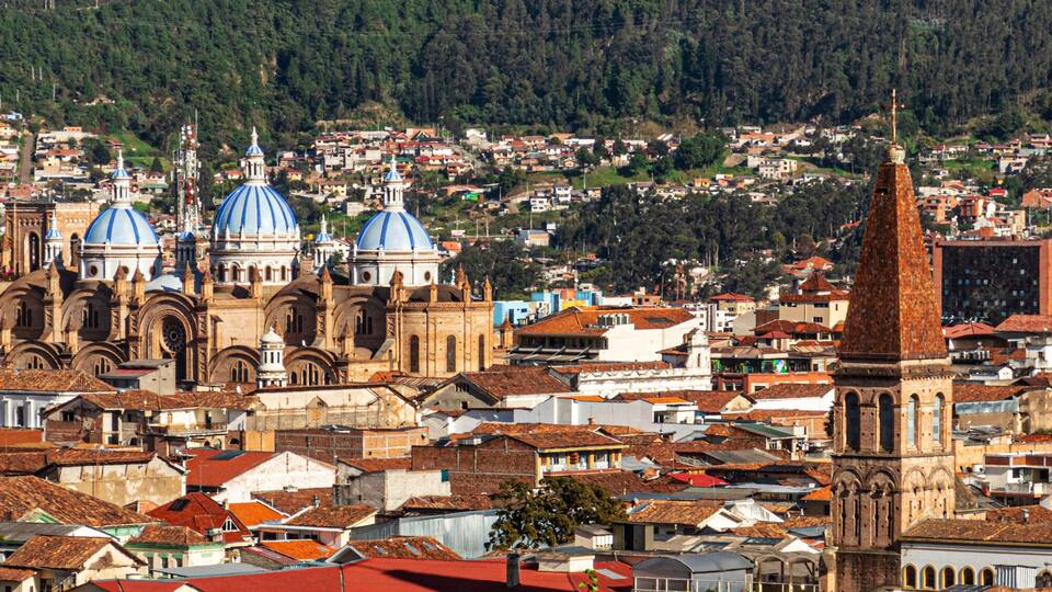 Panoramic view of the historical center of city Cuenca at the valley with its many churches. Ecuador