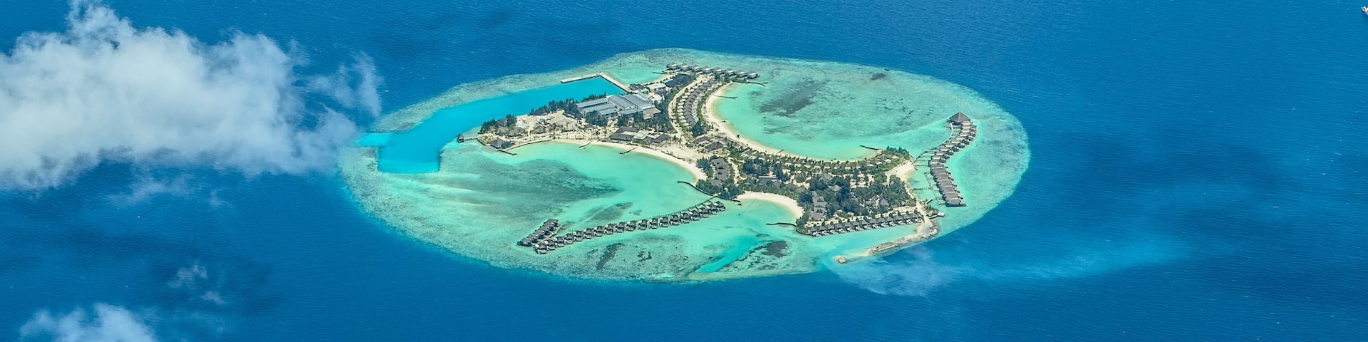 aerial landscape view of Feydhoofinolhu island located in Indian Ocean with beaches, buildings and infrastructure
