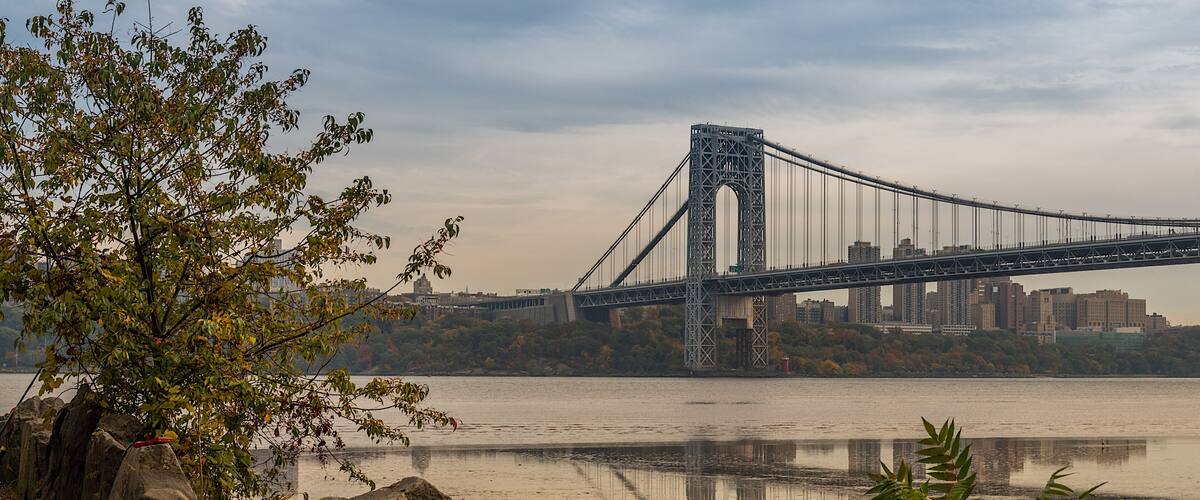 A distance view of George Washington Bridge in the evening from the Palisades Interstate Park in New Jersey