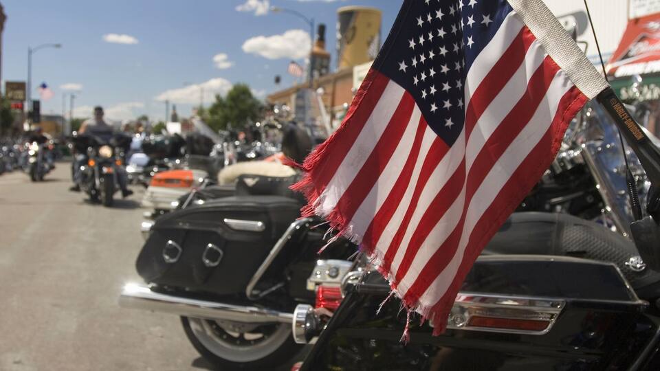 American Flag on the back of a motorcycle parked on Main Street at the 67th Annual Sturgis Motorcycle Rally, Sturgis, South Dakota, August 6-12, 2007