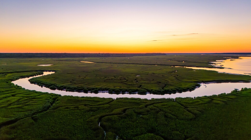 Sunset over marsh landscape with reflection