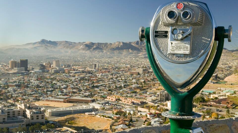 Long range binoculars for tourists and panoramic view of skyline and downtown of El Paso Texas looking toward Juarez, Mexico