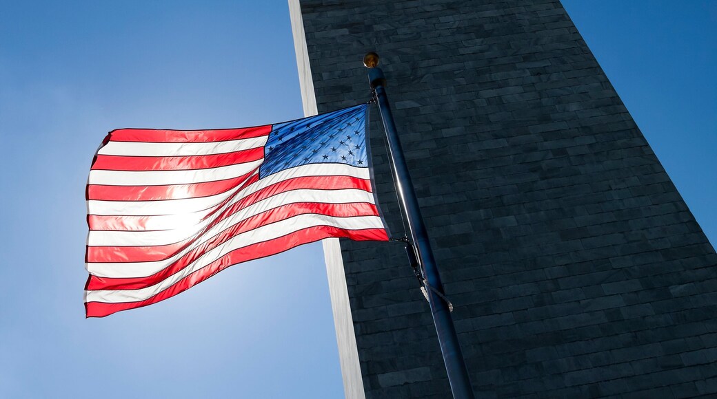 USA flag dark sky and Washington Monument
