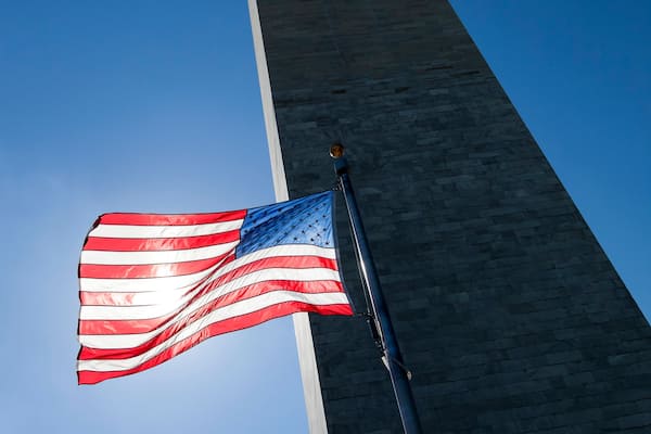 USA flag dark sky and Washington Monument