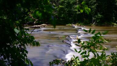 Sweetwater Creek Tumbles Gently Over a Span of Stones.