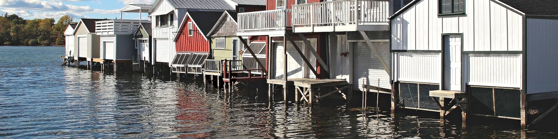 A row of boat houses on Canandaigua Lake in the Finger Lakes region of New York. Boathouses on Canandaigua Lake, New York, Shutterstock ID 131355452, purchase_order: SP-1269 HA 2018 Batch 1, Order: ,