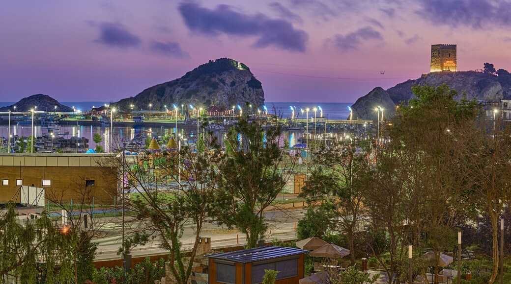 View of the Black Sea, Pier, Marina and Fortress at night and before dawn in Sile, Turkey. Seascape