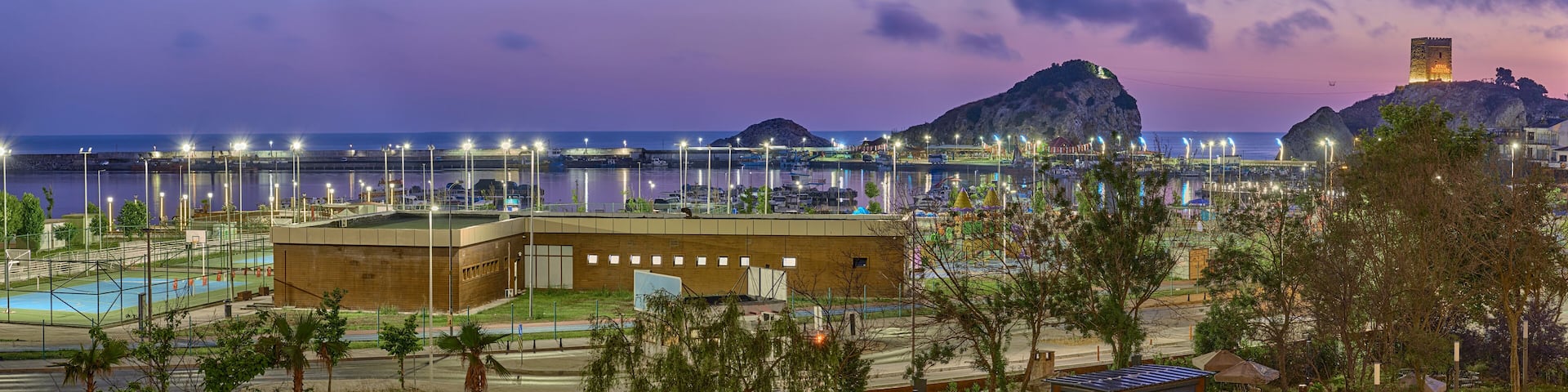 View of the Black Sea, Pier, Marina and Fortress at night and before dawn in Sile, Turkey. Seascape