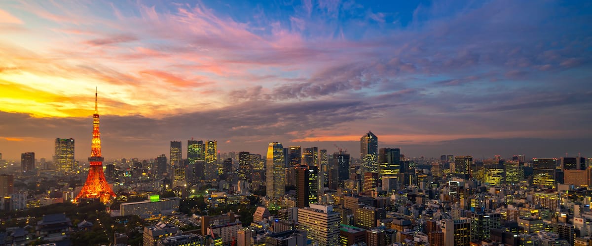 Panorama of Tokyo city skyline view and Tokyo Tower building at Japan with sunset and colorful sky. Beautiful of cloud and sky in dusk and twillight. Tokyo financial and business center zone.