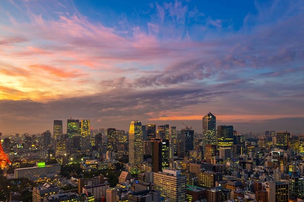 Panorama of Tokyo city skyline view and Tokyo Tower building at Japan with sunset and colorful sky. Beautiful of cloud and sky in dusk and twillight. Tokyo financial and business center zone.