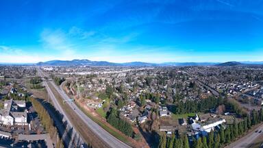 Aerial panoramic view of Springfield, Oregon looking East from Eugene at Interstate 5