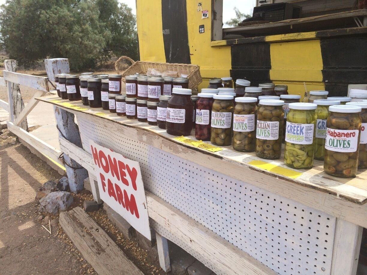 We stopped at this great little trailer on the main road down from Vegas to Yuma, AZ. She had honey, and many varieties of olives, plus an porta-potty! There is sometimes a wild and wailing inflatable arm flailing tube man on the road as well as three signs along the road to help guide you to the place. #whiskeysister
