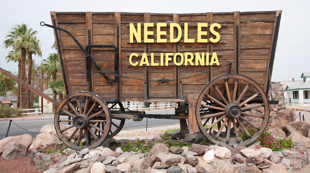 Covered wagon welcomes drivers to Needles California sign and Route 66, California .
