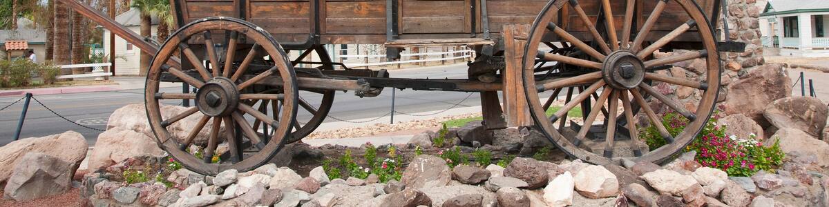 Covered wagon welcomes drivers to Needles California sign and Route 66, California .
