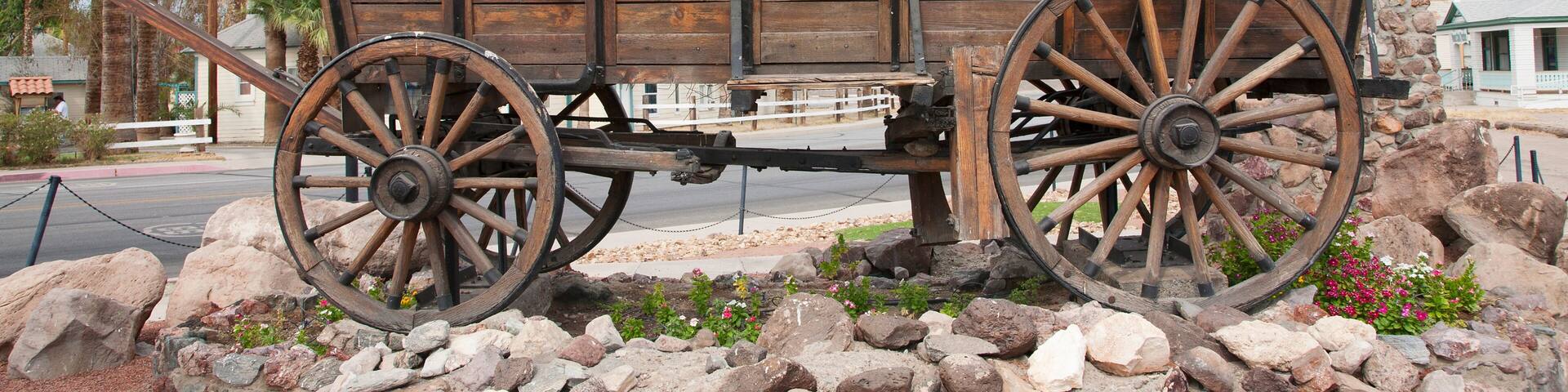 Covered wagon welcomes drivers to Needles California sign and Route 66, California .