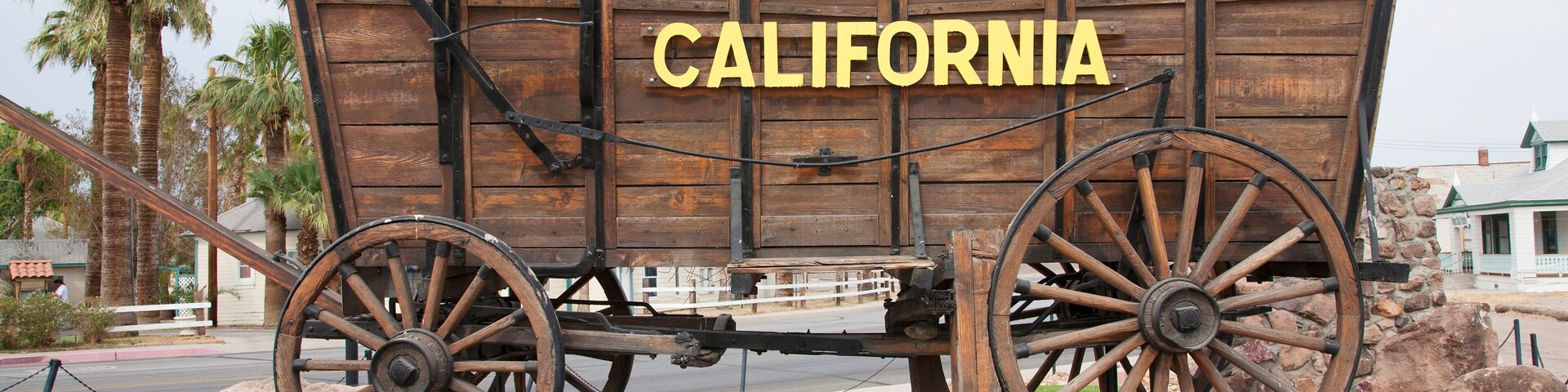 Covered wagon welcomes drivers to Needles California sign and Route 66, California .