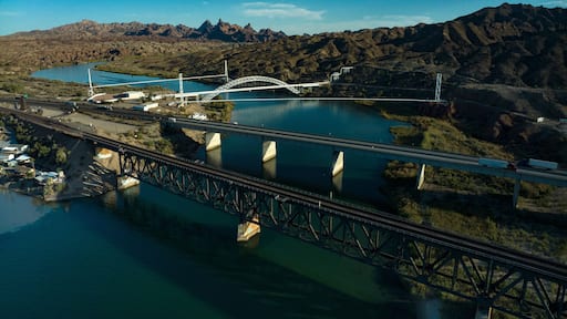 OCTOBER 17, 2023, USA - Interstate Highway 40 crosses Colorado River at Needles, CA. showing trains, highways, bridges and waterways