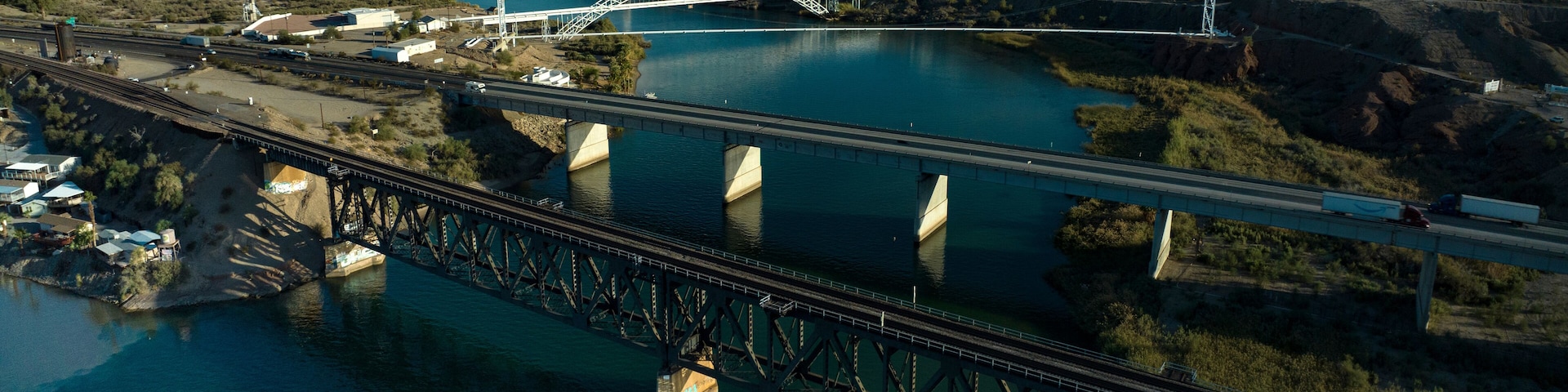OCTOBER 17, 2023, USA - Interstate Highway 40 crosses Colorado River at Needles, CA. showing trains, highways, bridges and waterways