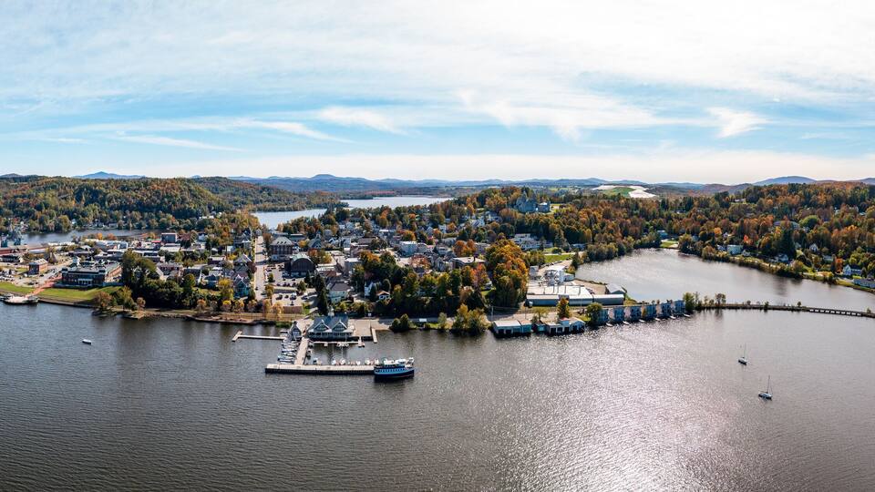 Aerial view of the city of Newport in Vermont from above the lake with autumn colors and leaves