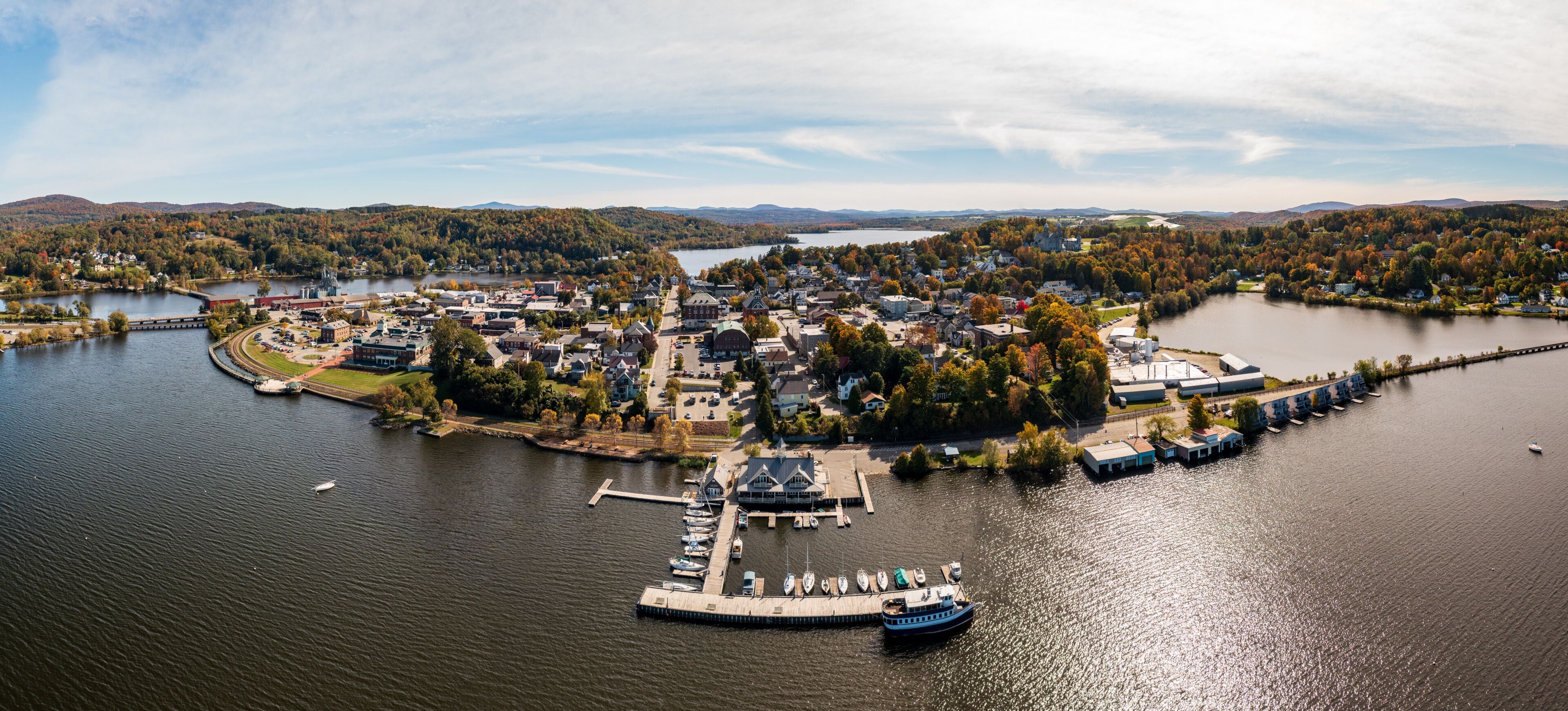 Aerial view of the city of Newport in Vermont from above the lake with autumn colors and leaves