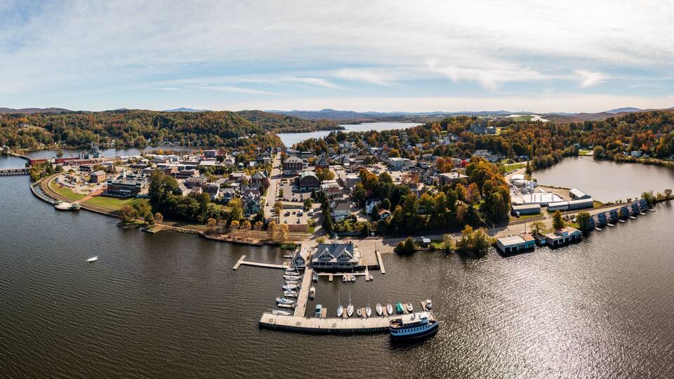 Aerial view of the city of Newport in Vermont from above the lake with autumn colors and leaves
