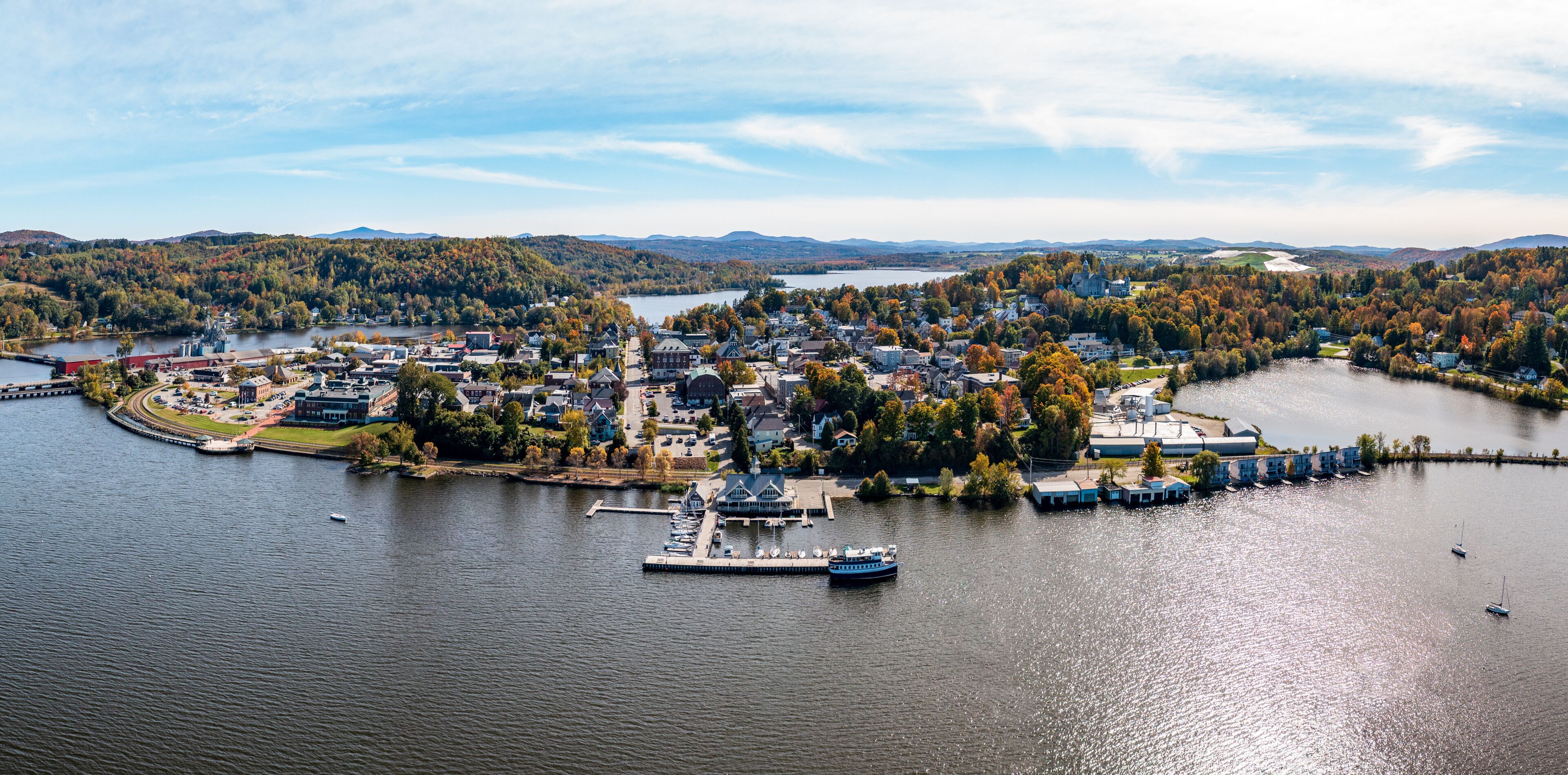 Aerial view of the city of Newport in Vermont from above the lake with autumn colors and leaves
