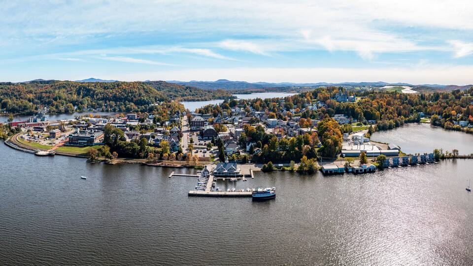Aerial view of the city of Newport in Vermont from above the lake with autumn colors and leaves