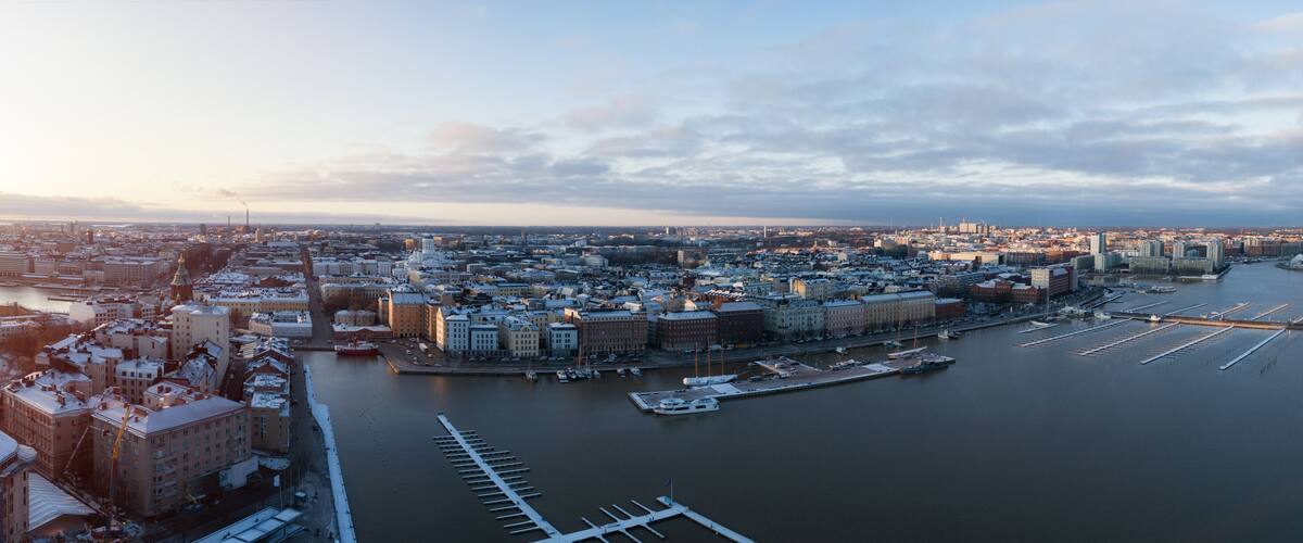 Scenic winter view of the Old Port in Katajanokka district with Uspenski Orthodox Cathedral at sunset in Helsinki, Finland