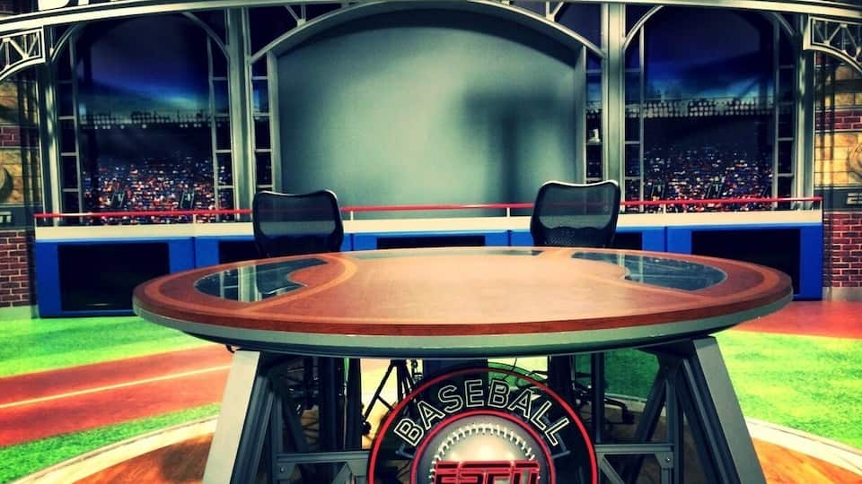 A baseball stadium with a large screen displaying 'BASEBALL TONIGHT' and 'ESPN 25'.