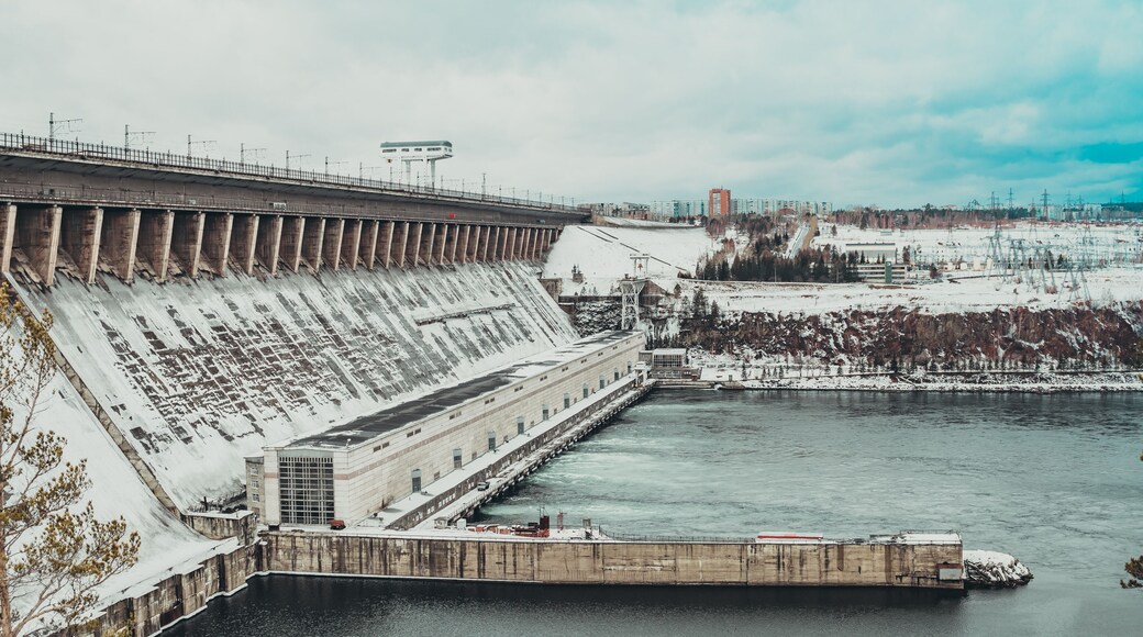 Bratskaya hydroelectric power station in winter in the snow on the Angara river