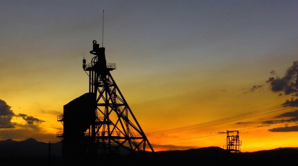 Butte featuring a sunset
