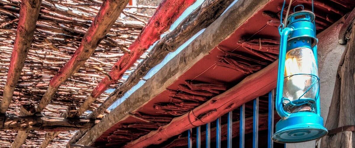 A row of colorful, traditional houses with wooden beams and painted walls.