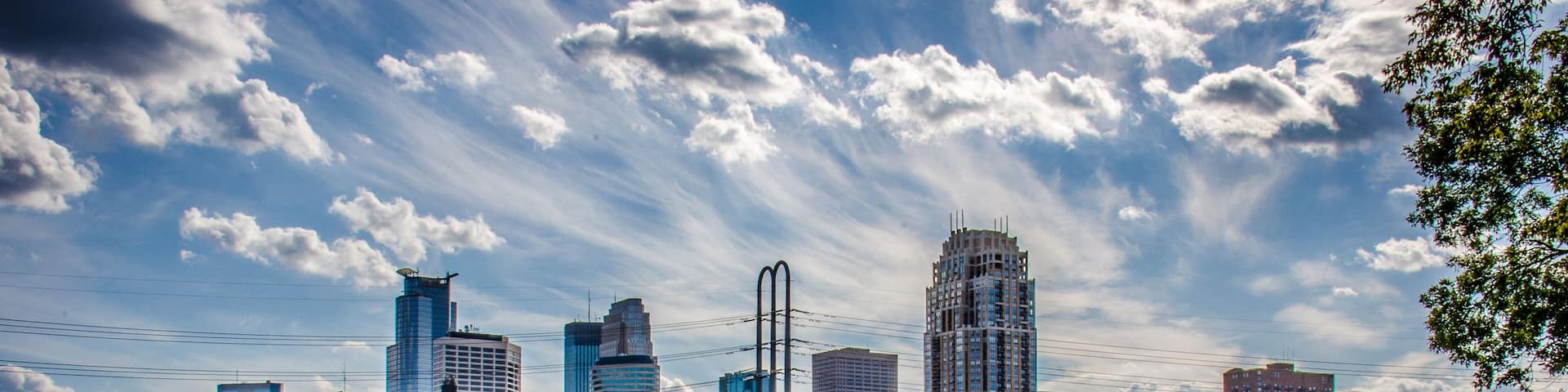 Daytime Cityscape skyline of Downtown Minneapolis Minnesota in the Twin Cities Metro area. Reflection in the Mississippi River