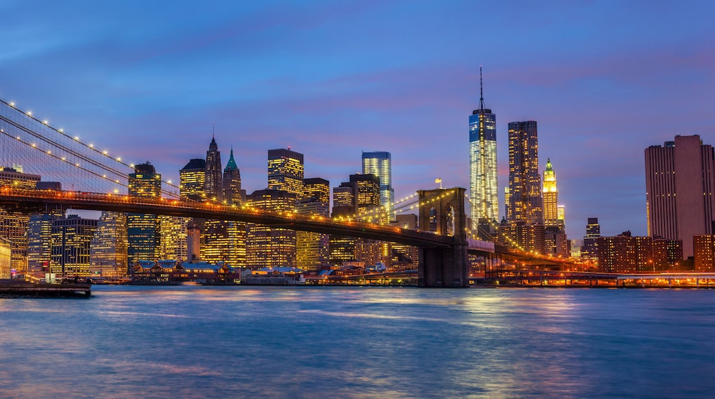 Panorama of Brooklyn Bridge with lights and reflections