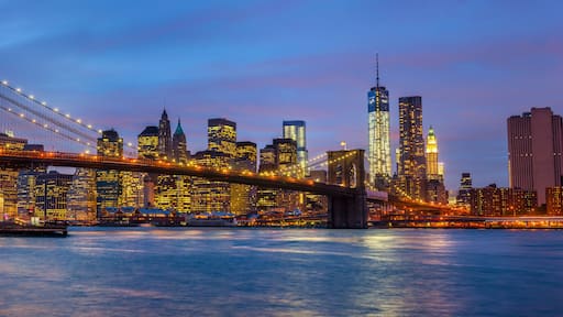 Panorama of Brooklyn Bridge with lights and reflections