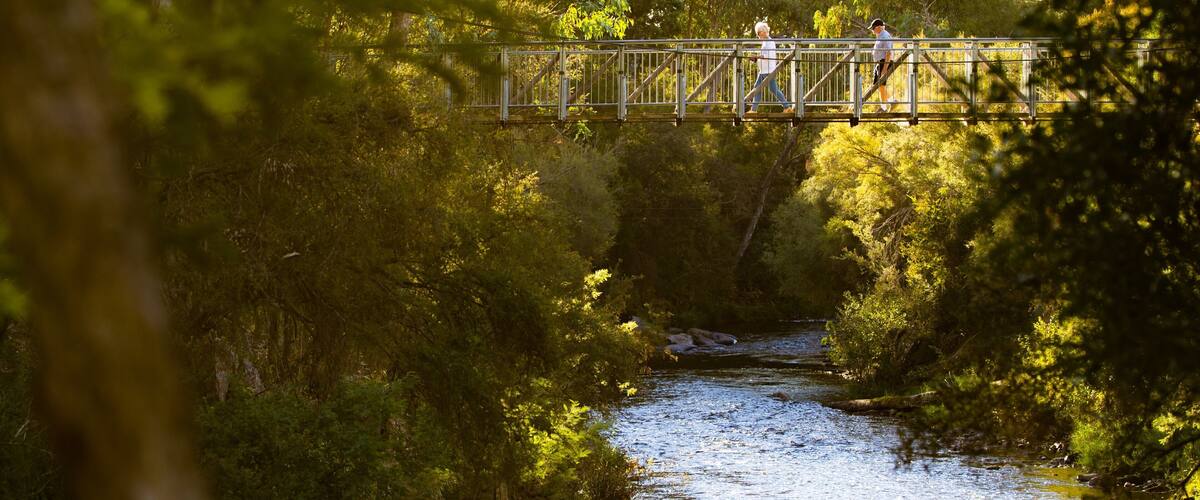 Canyon Walk featuring a river or creek and a bridge