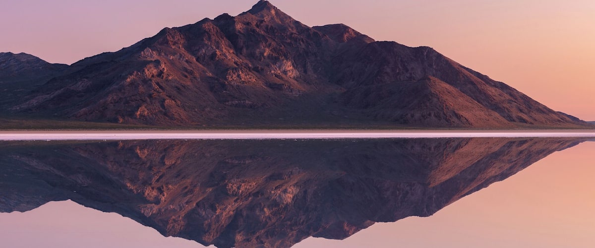 The sun rose and the mountains breathed in the warming morning air. There were still a few minutes of quiet calm before the wind woke up and the sky turned it's day blue.