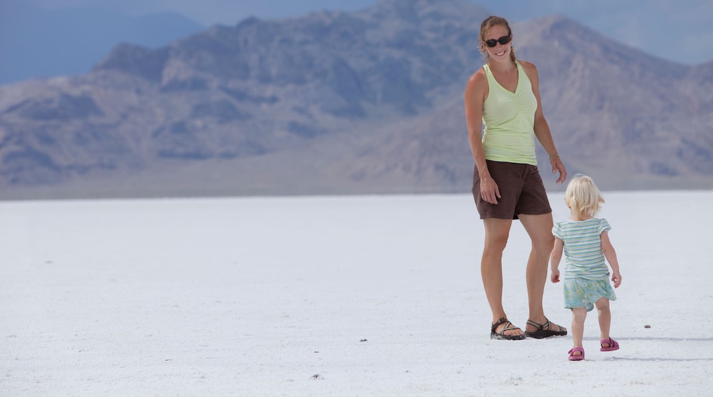Female adult and young female toddler standing on the Utah salt flats