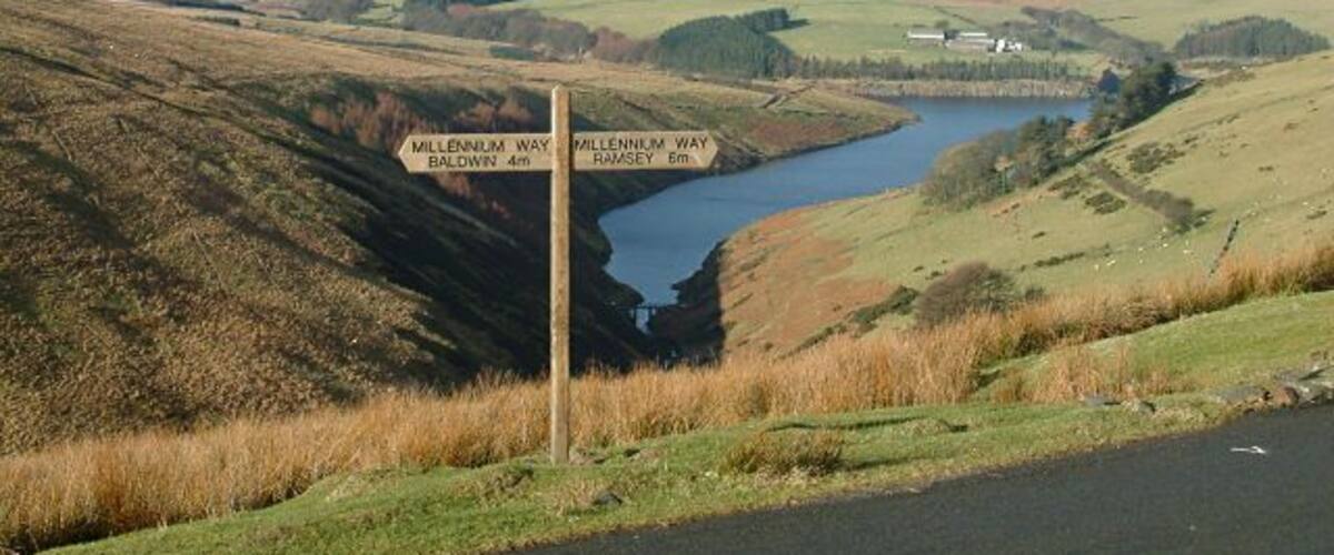 The Millennium Way - Isle of Man. This is the point at which the Millennium Way crosses the Tholt-y-Will road, with Sulby Reservoir as a backdrop.