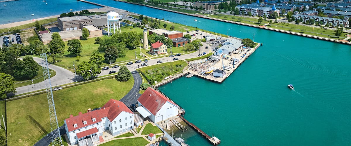 Aerial View of Marina and Red Lighthouse in Lakeside Town